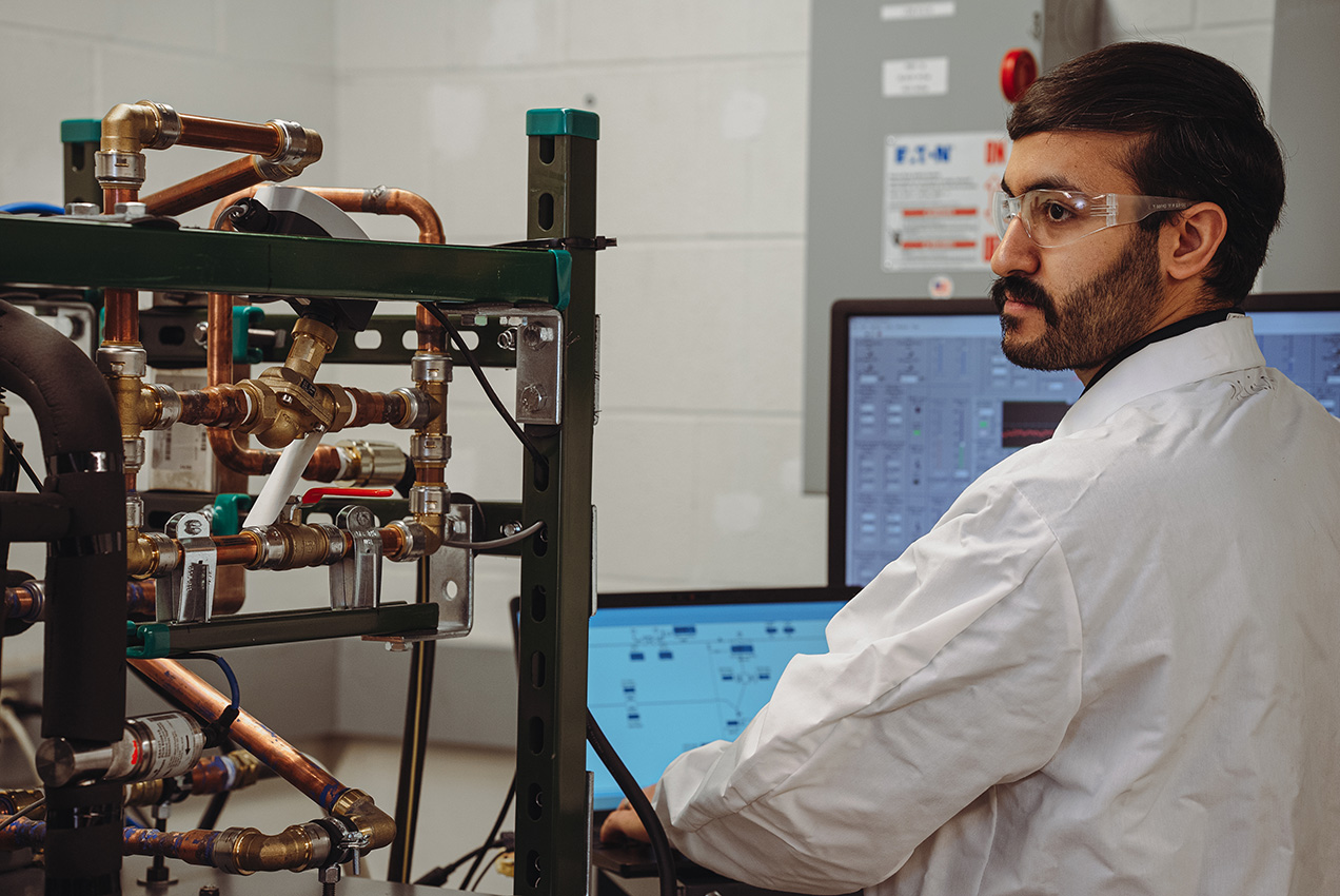 male graduate student at equipment