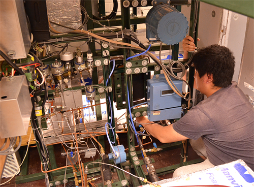 student working on ACRC equipment in lab